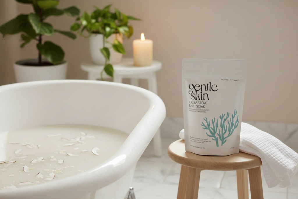 OceanOat Bath Soak lifestyle scene beside a premium roll-top bath with candle in background